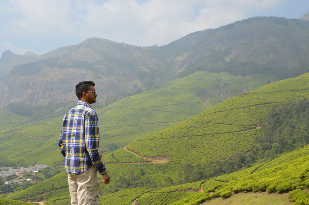 Overlooking the vast green mountains of the Kolukkumalai Tea Estate in Kerala India