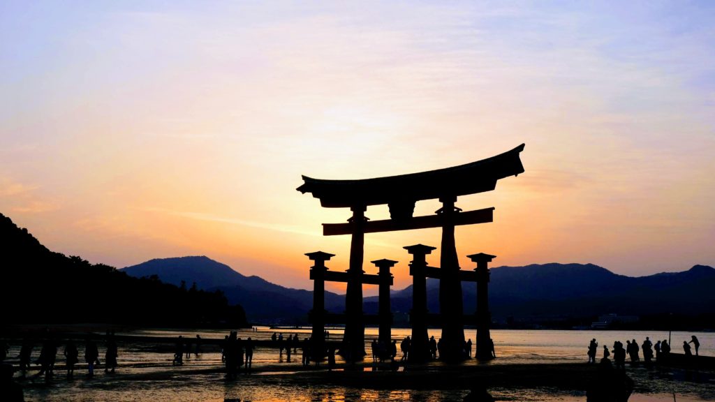 Sunset by the itsukushima floating torii gate at Miyajima Island