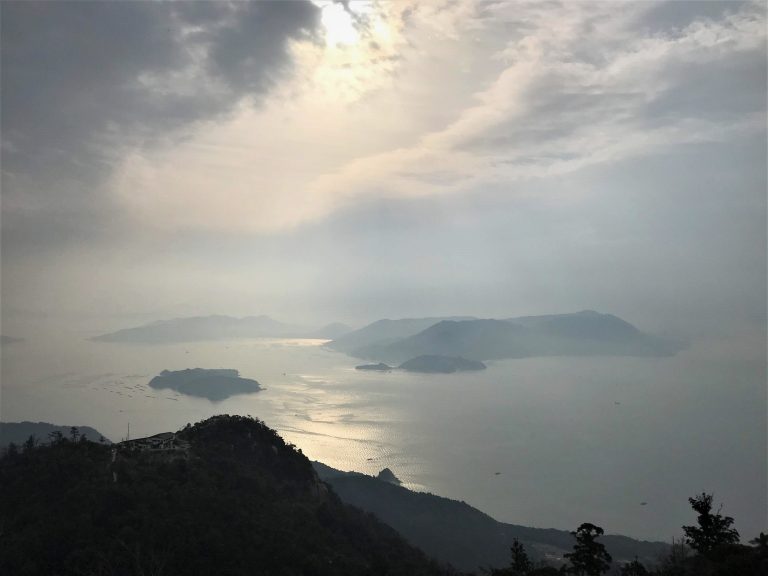 Morning Sun shines on the surrounding water of Miyajima Island.