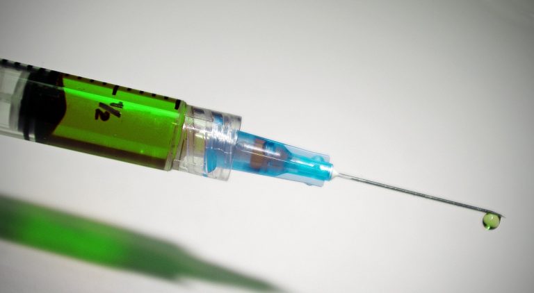 A syringe and needle up close