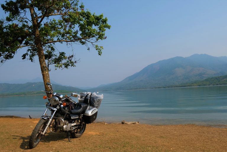 Motorbike with a lake backdrop