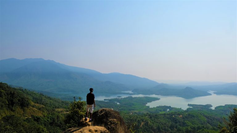 Nishil overlooking jungle scenery on Ho Chi Minh Trail