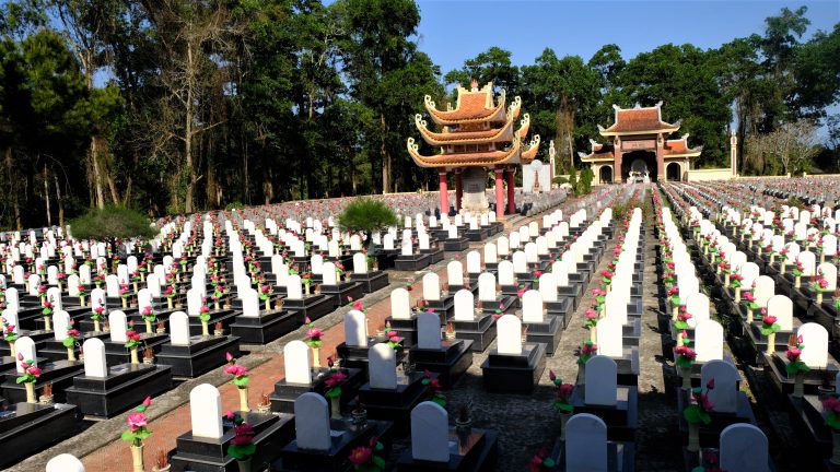 Rows of graves and flowers at Truong Son Cemetery