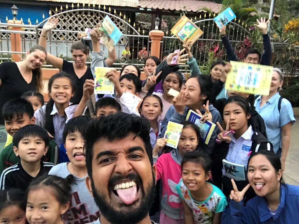 Kids pose with books and make funny faces