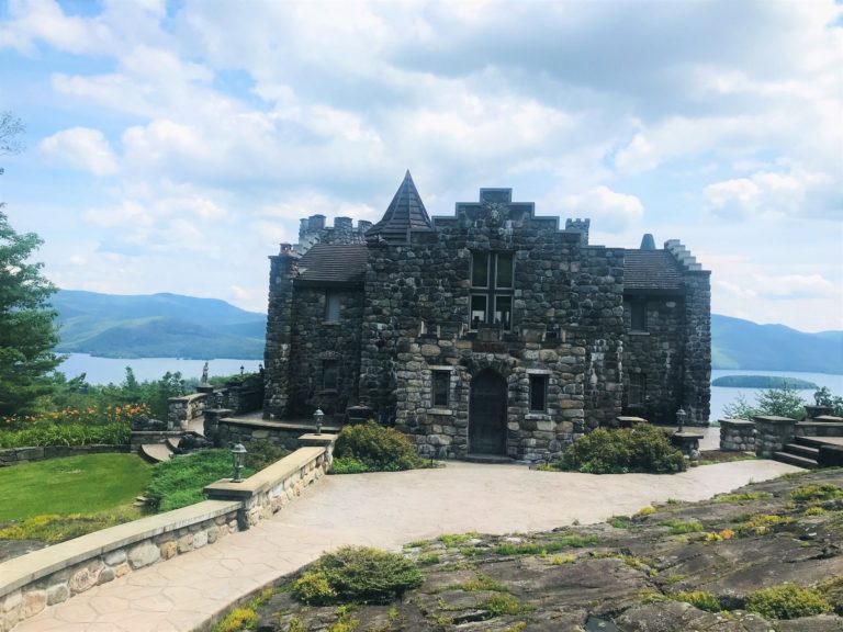 Highlands Castle sitting in front of the scenic Lake George backdrop