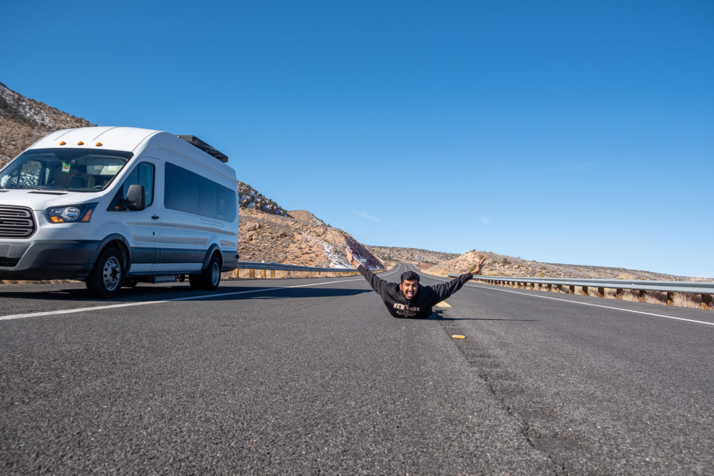 Nishil on the Road next to Camper Van