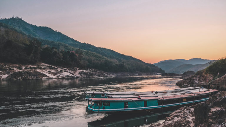 Boat Sits on Mekong River during sunset