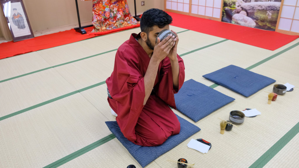 Nishil Drinking Tea at Ceremony