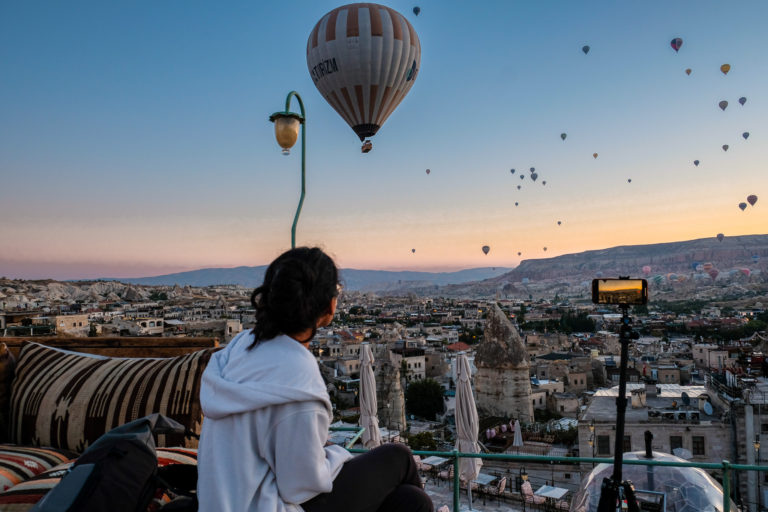 Anmol watches over balloons from hotel terrace