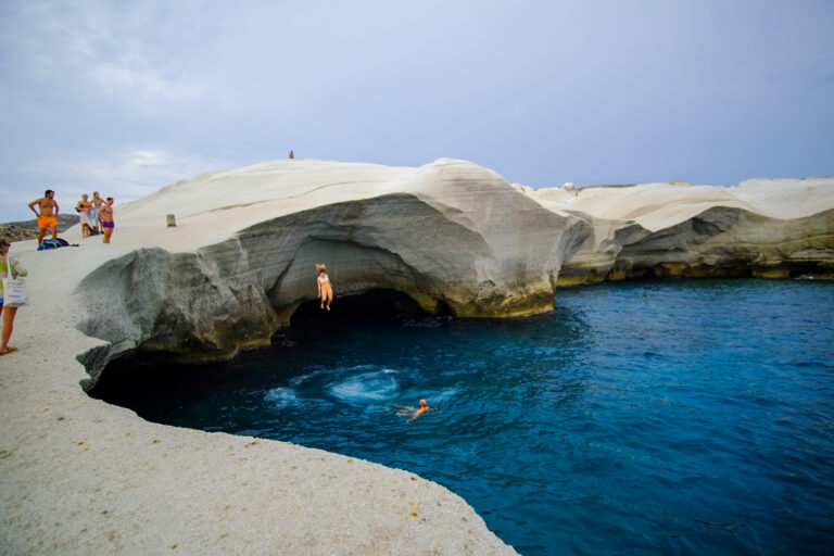 Lady cliff jumping on Sarakiniko Beach